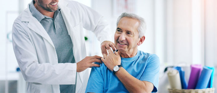 Doctor with hand on patient